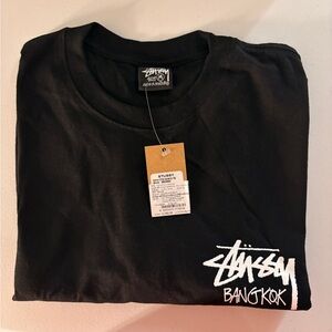 Stussy Black Graphic Tee with White Bangkok Logo